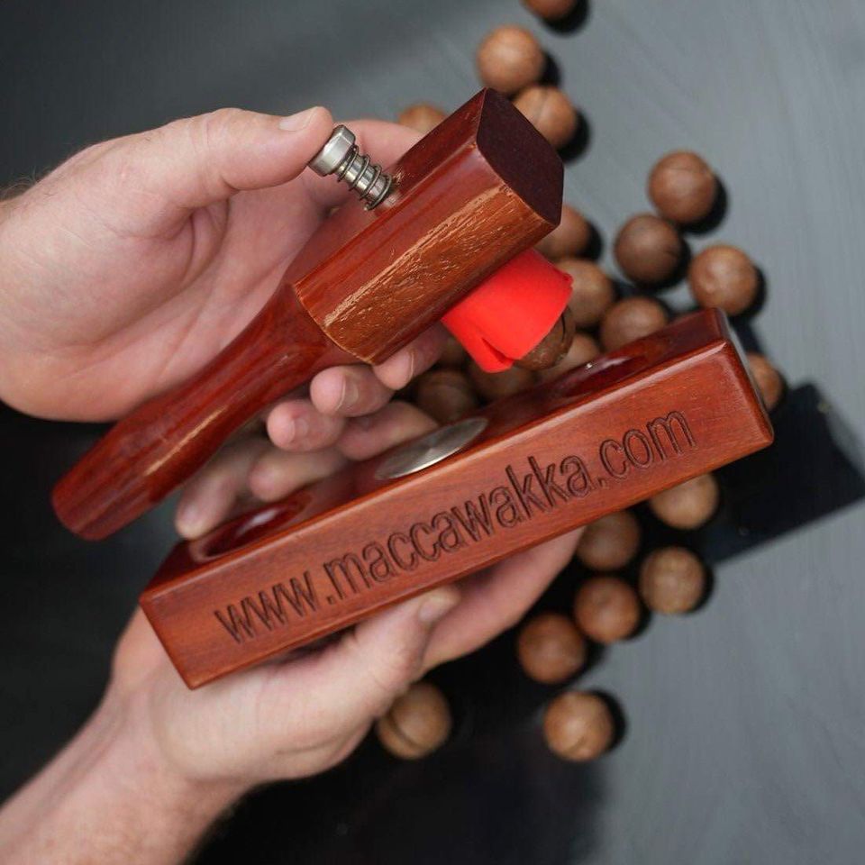 Close-up of the red silicone cup on the MaccaWakka hammer, held in a hand