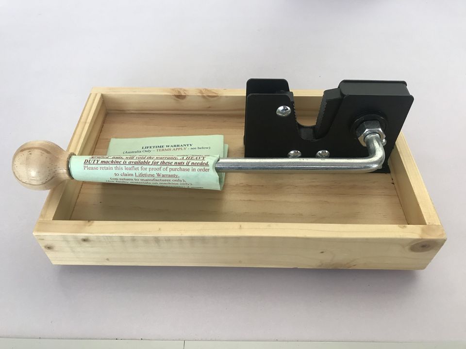 CJ's lever-type nut cracker in a timber tray