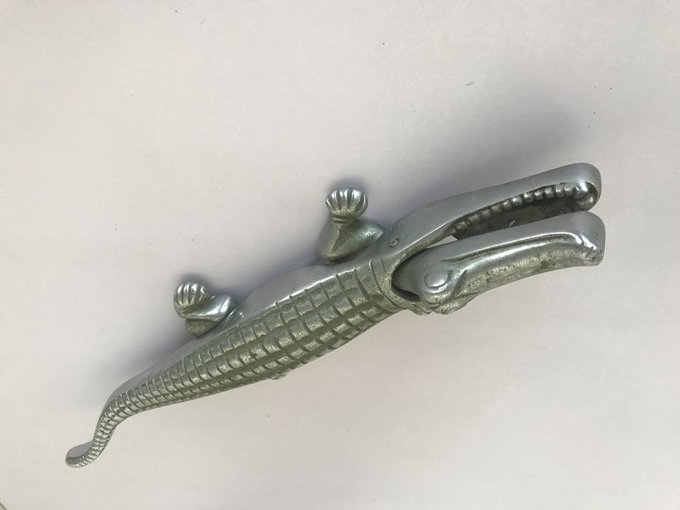 The silver crocodile macadamia nut cracker, a cast metal lever cracker