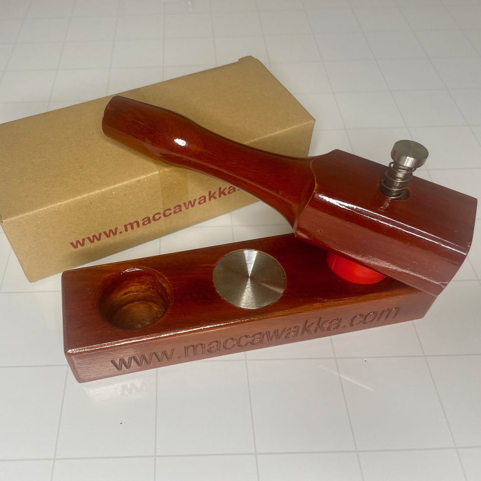 MaccaWakka macadamia nut cracker standing on its box